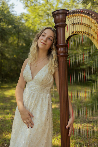 High school graduate with harp at Costley Mill Park