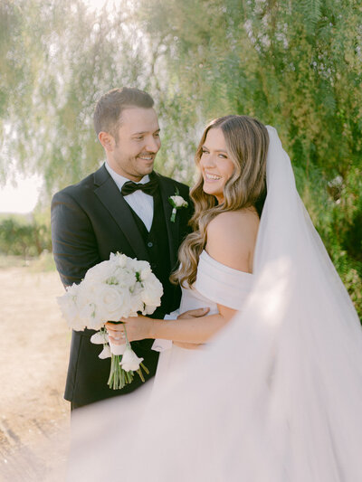 In the golden hills of Southern California, Adam and Bianca’s destination wedding unfolded with cinematic elegance at the renowned Falkner Winery—an estate where vines meet timeless vows. Captured through the refined lens of Michael Asmussen, an internationally recognized destination wedding photographer known for his editorial style and luxury storytelling, this celebration blended San Diego’s wine country charm with effortless sophistication. From sunlit portraits to curated design moments, every frame tells a story of intention, artistry, and romance. Michael’s work spans the most coveted destinations—Orange County, Palm Desert, Los Angeles, Tokyo, Las Vegas, Seoul, and beyond—crafted for modern couples who desire more than memories: they seek legacy.
