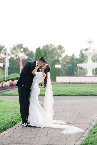 Bride and groom kissing by Knoxville Wedding Photographer, Amanda May Photos