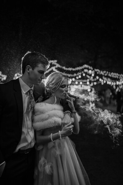 bride smoking cigar with groom