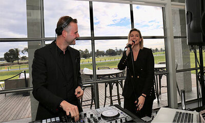 Corporate DJ Hire male and female duo with male DJing and female singing