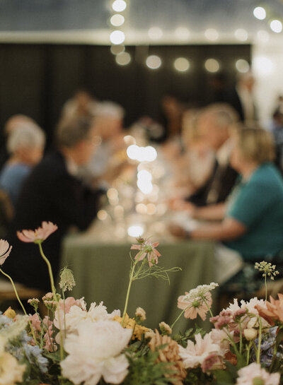 This intimate tented wedding at the bride’s childhood family cottage in Val-Des-Monts, Quebec, exudes rustic charm and personal touches. The scenic backdrop of lush greenery and serene lake views enhances the romantic atmosphere. The cozy tent is adorned with elegant floral arrangements, twinkling fairy lights, and handcrafted details that reflect the couple's love story. This beautiful celebration combines the warmth of home with the elegance of an outdoor wedding. Keywords: intimate wedding, tented wedding, family cottage wedding, Val-Des-Monts wedding, rustic wedding, outdoor wedding, personalized wedding details.