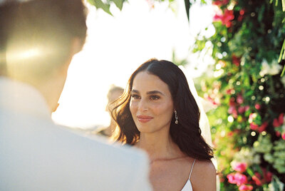 Bride and groom exchange vows during an elegant Casa de Campo beach wedding ceremony, captured by Asia Pimentel Photography.