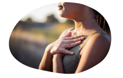 Woman with hand on heart after session with trauma therapist California