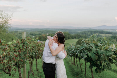 Couple hugging on their wedding day at Long Leaf Vineyard in Asheville