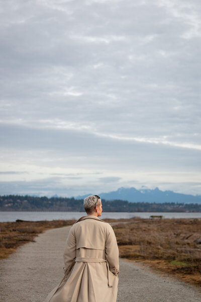 Amy walking on a path at Crescent Beach