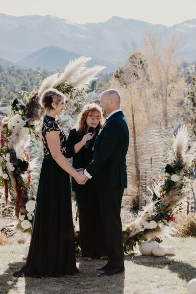 couple getting married in black