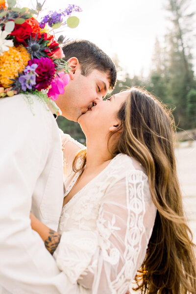 Bride and groom have their first kiss at their Shaver Lake elopement