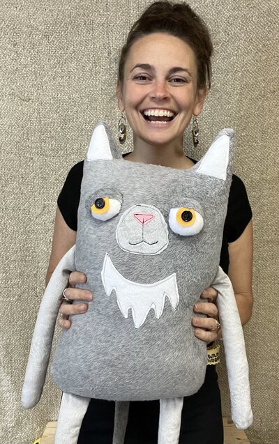 Natalie holding artistic plush toy