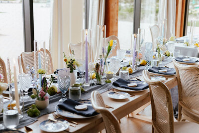 Wedding tablescape with purple candles and florals
