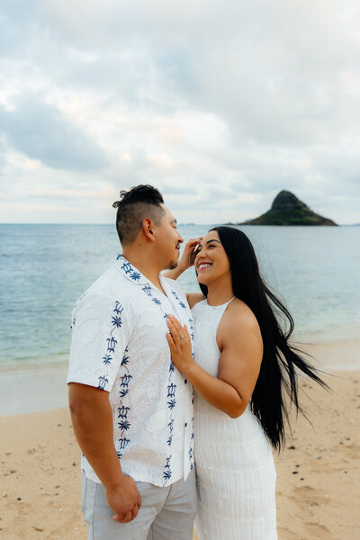 Vibrant couples portraits taken in Oahu, Hawaii at Kualoa Beach