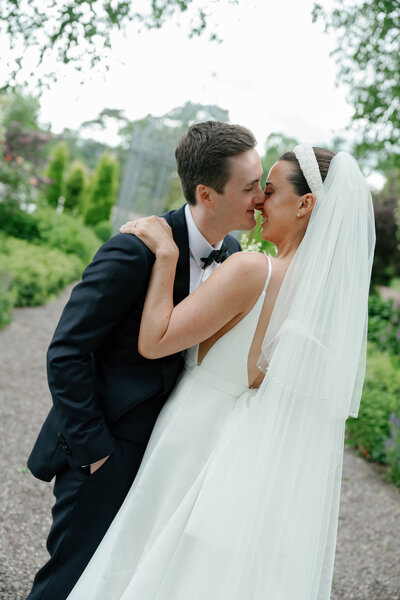 bride and groom wearing a tuxedo photo taken at a destination wedding in italy