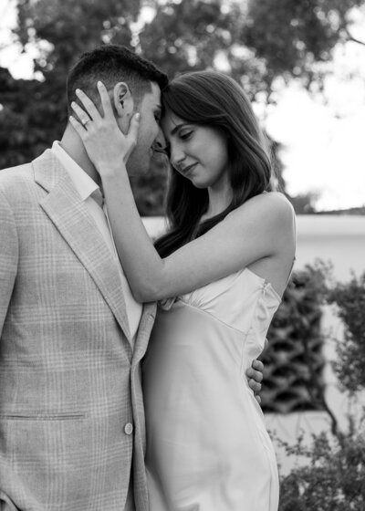 Bride and groom post together for a photo the night before their wedding at El Chorro in Paradise Valley, AZ during their rehearsal dinner at the venue. 