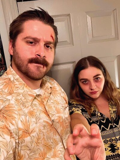 Man and woman dressed as Stranger Things characters for halloween.