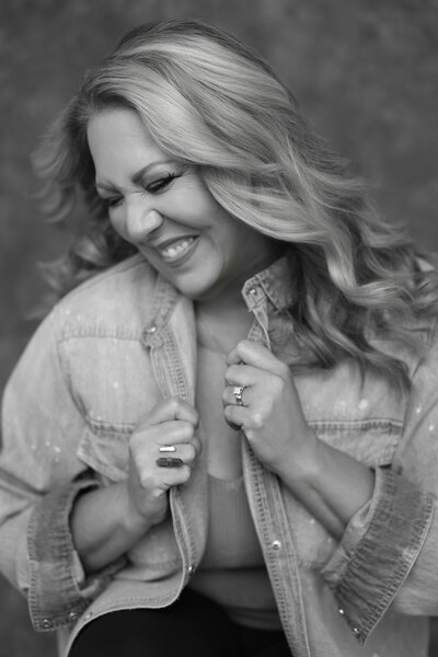 Man sitting in chair taking photos for LinkedIn profile picture
