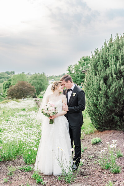 bride and groom posing for a portrait on their wedding day