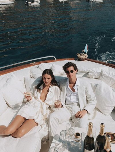 couple on boat in lake como luxury italy trip planning