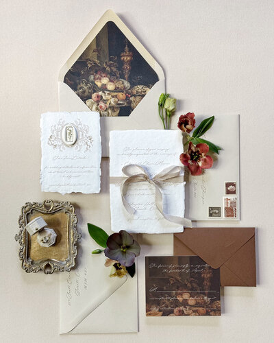 Heirloom wedding invitation suite with letterpress on handmade paper, featuring an antique painting on the envelope liner and rsvp card.