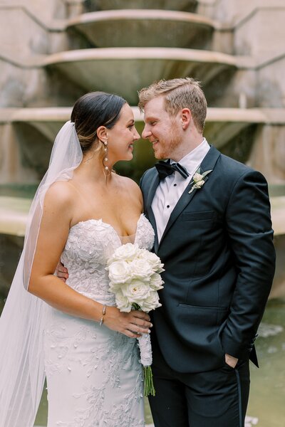 Husband looks at wife after getting married at the Swan House in ATL Georgia