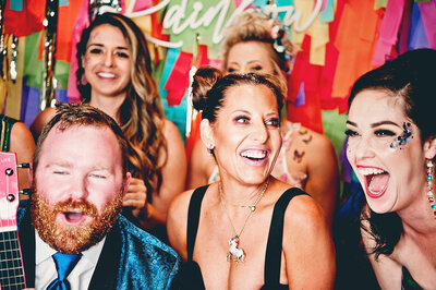 Group of guests laughing and enjoying a colorful corporate event in Phoenix, Arizona—photographed by MISGIF’s professional event photography team, known for capturing authentic, high-energy brand moments and candid interactions.