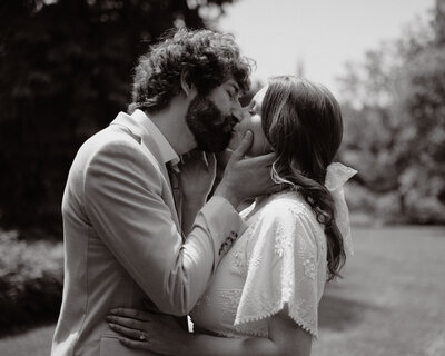 the happy couples shares a kiss at city hall