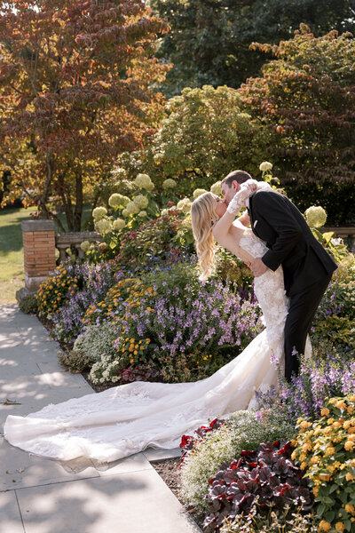 A bride smiles at her bridesmaids.
