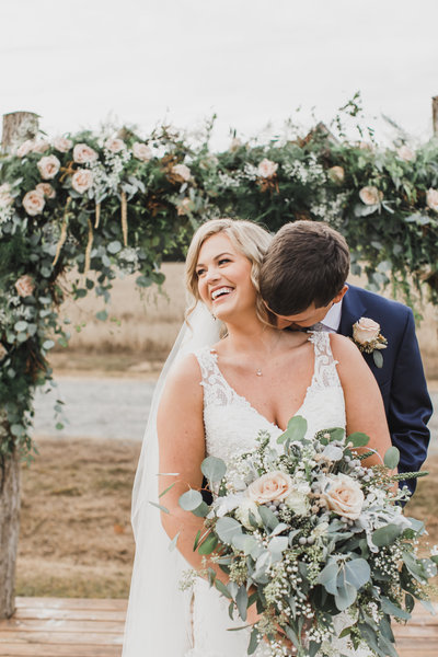 Wedding Photographer & Elopement Photographer, groom kissing bride on her neck