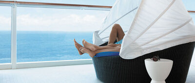 couples feet on lounge chair on cruise ship