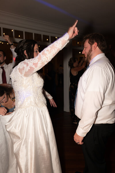 Newlyweds dancing together at their wedding reception