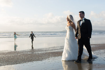 Bride and Groom walking on beach at their elopement at Loews Coronado