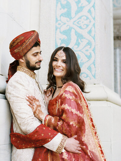 Bride and groom  photo wearing Red and gold nikah outfits