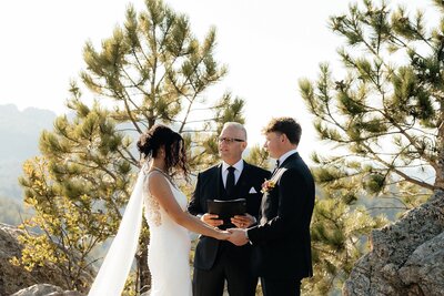 The bride and groom during their elopement ceremony at Breezy Point Picnic Area in Keystone, South Dakota.