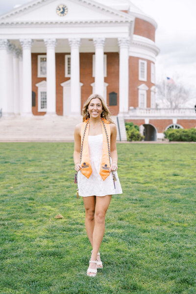 College senior standing in front of campus building