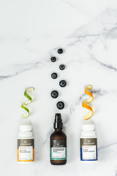 Skincare products styled with citrus and berry ingredients