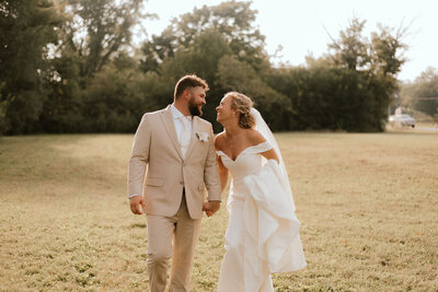 bride and groom embrace on wedding day in peoria il