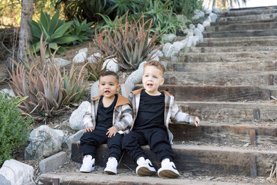 two kids sitting on steps
