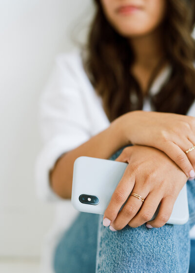 Woman holding phone in hand