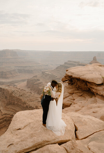 Moab, Utah Wedding photography at Dead Horse State Park of a young mixed couple