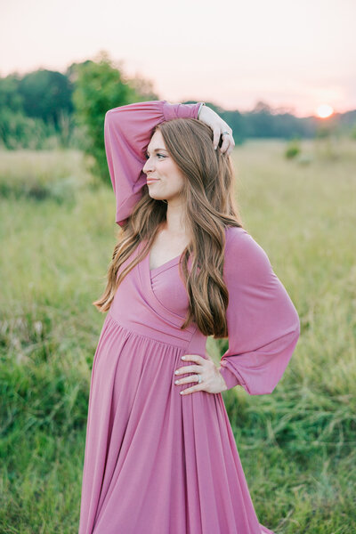 Expecting mom holding her belly bump during her maternity session with molly berry photography