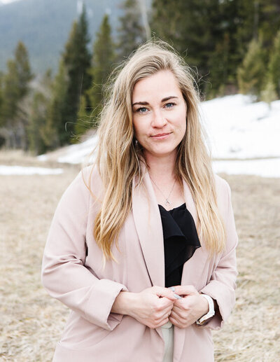 Realtor Tamara Rzan amidst the mountains and pine trees of Bairmore