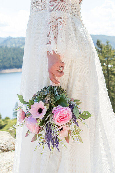 rocky mountain elopement packages to include detail shots like this one with the bride's flowers