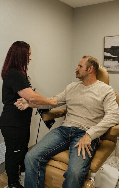 A nurse takes the blood pressure of a male patient for a medical weight loss program at Rocky Mountain Wellness Clinic in Idaho Falls, ID.