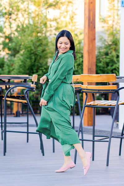 Woman twirling during branding photography in Arlington, Virginia