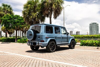 mercedes-g63-china-blue-for-rent-in-miami-rear-quarter-view-014