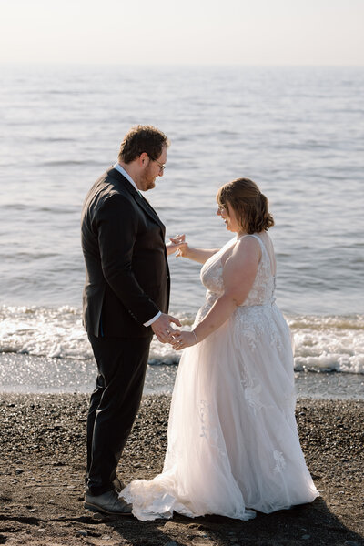 Bride and groom dancing on the beach at Lake Erie.