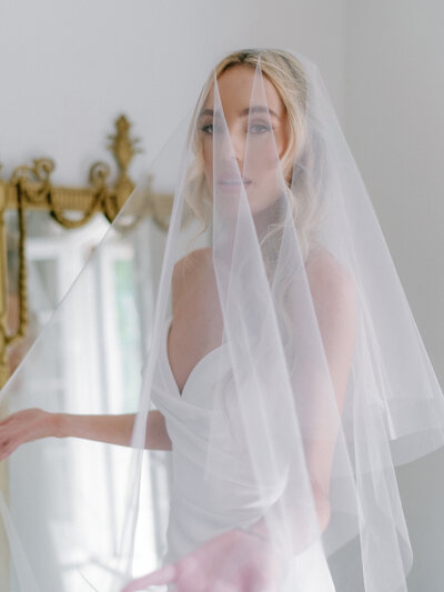 Editorial bridal portrait of a bride getting ready at The St. Regis Atlanta
