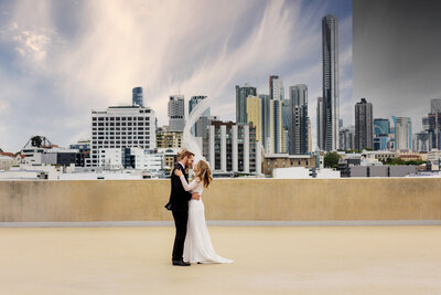 Bride and groom walking together at The Calile Hotel Brisbane — stylish and modern Brisbane wedding photography with a luxury feel.
