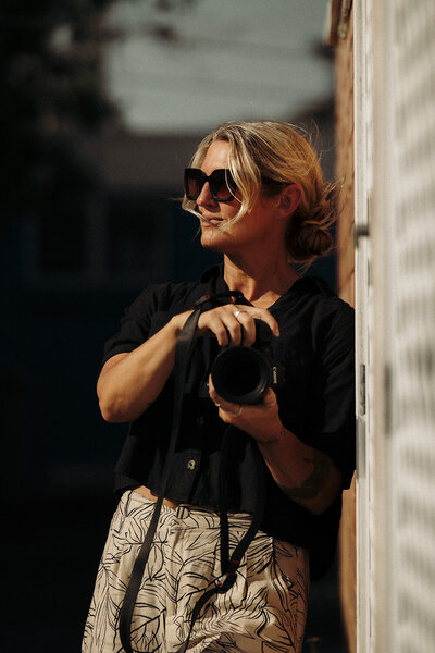 Portrait of Sunshine Coast photographer Nicci K, framed in warm natural light.