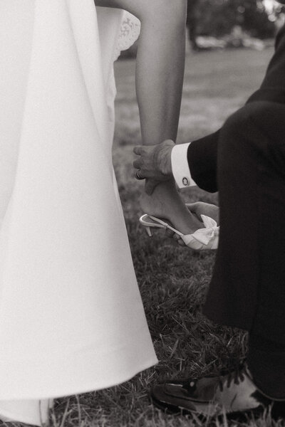 Poetic editorial shot of a wedding couple inside a grand historic venue.