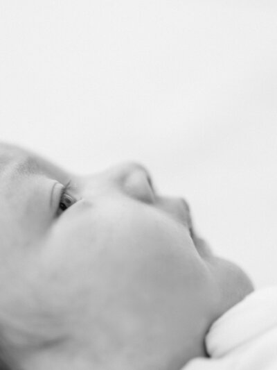 Black and white photo of a close-up of a newborn baby's face